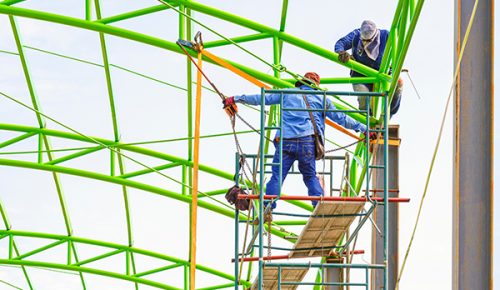 two-construction-workers-on-scaffolding-are-fixing-2022-11-04-23-59-26-utc